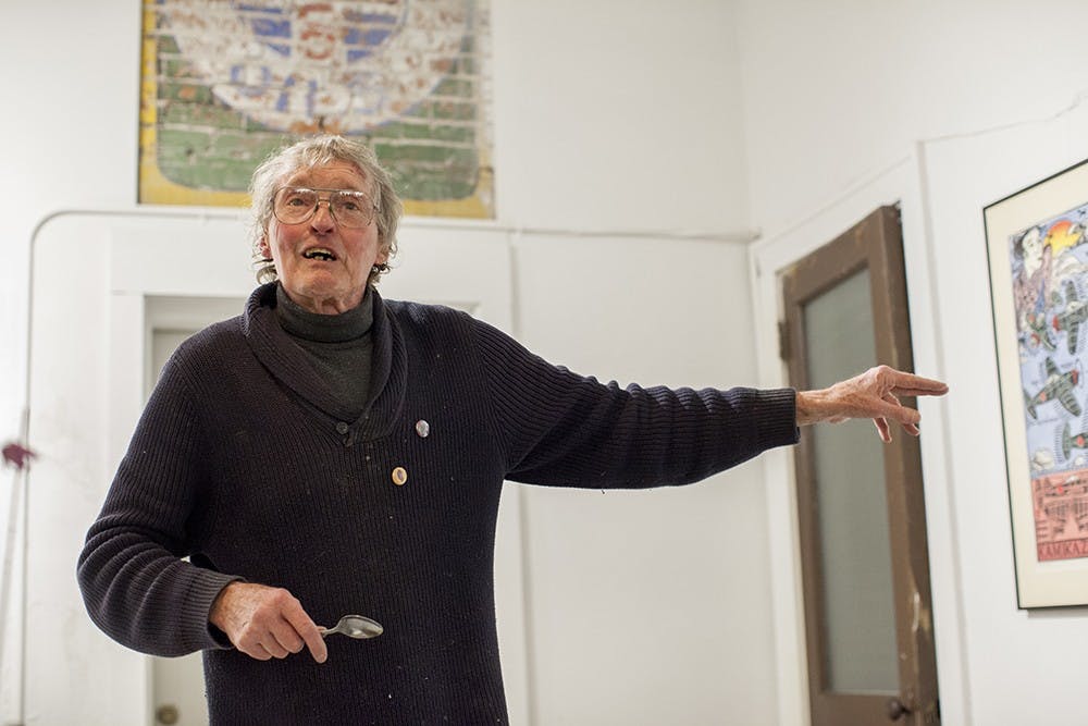 Printmaker Jim Simpson talks about his linocut prints at Blueline Media Productions on Thursday.  His work will be on display until Jan. 30th.