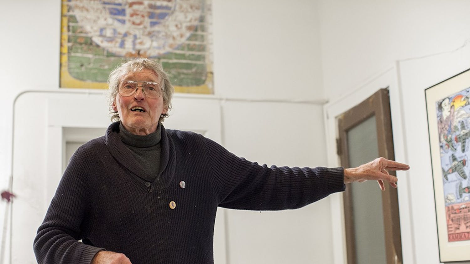 Printmaker Jim Simpson talks about his linocut prints at Blueline Media Productions on Thursday. His work will be on display until Jan. 30th.