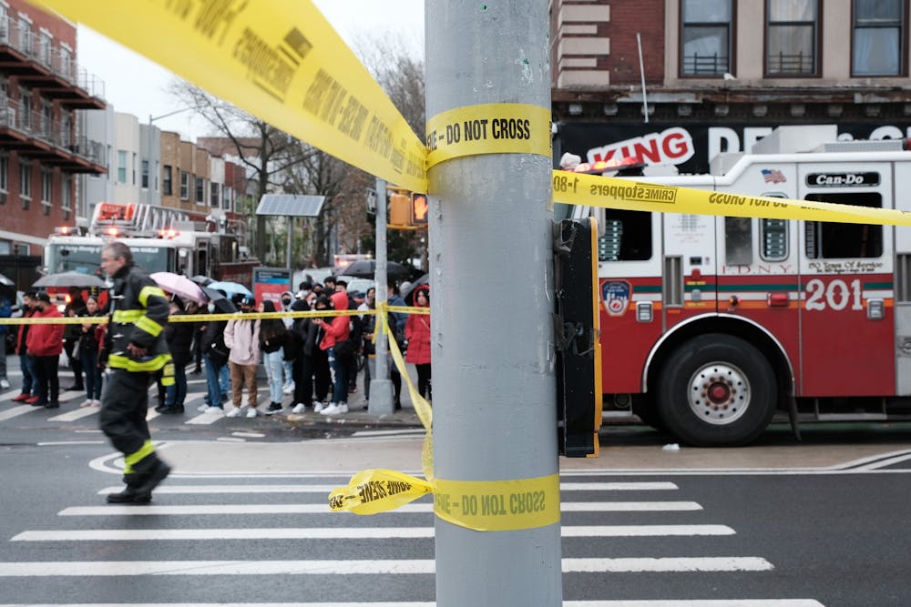 <p>Police and emergency responders on the site of the shooting at a Brooklyn subway station on April 12, 2022, are pictured.  </p>