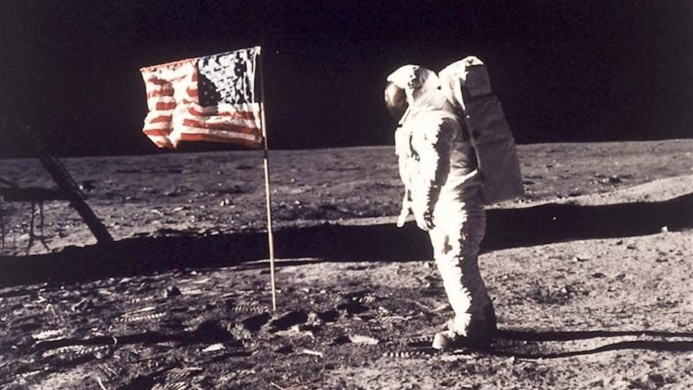 FILE - In this July 20, 1969 file photo,  Astronaut Edwin E. "Buzz" Aldrin Jr.  poses for a photograph beside the U.S. flag deployed on the moon during the Apollo 11 mission.  