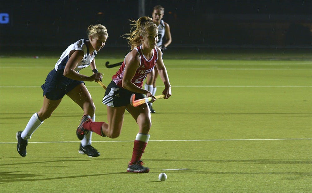Sophomore midfielder Taylor Pearson breaks through the defense of Penn State University during the game on Thursday evening. IU lost the game, 3-1. 