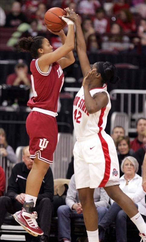 Indiana's Whitney Thomas goes up for a shot over Ohio State's Jantel Lavender during the first half Sunday at Ohio State University in Columbus, Ohio.