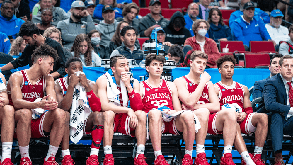 The Indiana bench watch the game slip away Mar. 17, 2022, at the Moda Center in Portland, Oregon. Indiana lost 53-82 against Saint Mary’s College.