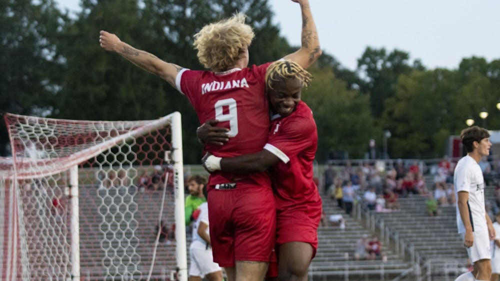 Junior forward Sam Sarver (left) and freshman forward Collins Oduro (right) embrace after scoring a goal Sept. 19, 2023, against Butler University at Bill Armstrong Stadium in Bloomington. Oduro assisted Sarver on the goal against the Bulldogs.