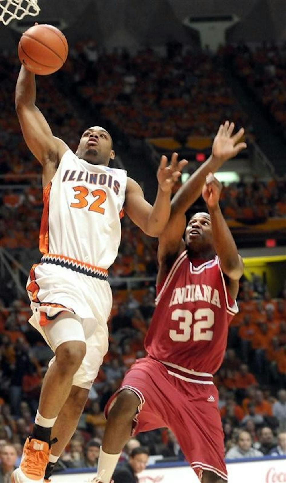 Illinois’ Demetri McCamey drives to the basket ahead of IU’s Broderick Lewis in the first half of Saturday’s game in Champaign, Ill. The Hoosiers fell to the Illini 76-45 for their sixth straight loss.