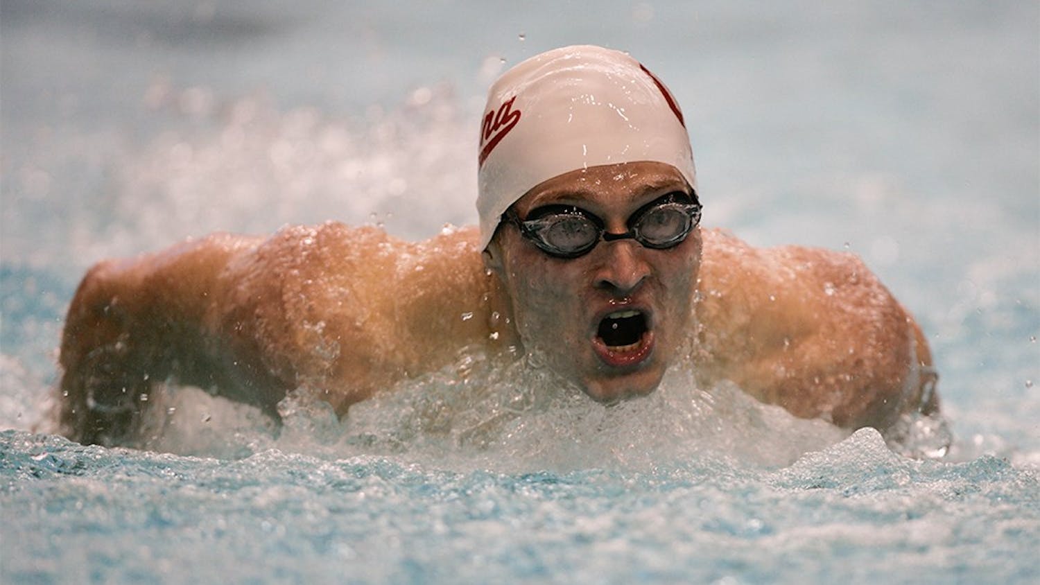 Junior Max Irwin comes into the wall during the first length of the 200M Butterfly. The Hoosiers competed in a duel meet against the Wisconsin Badgers on November 13th, 2015, with the men winning 184-116 and the women winning 182-114. 
