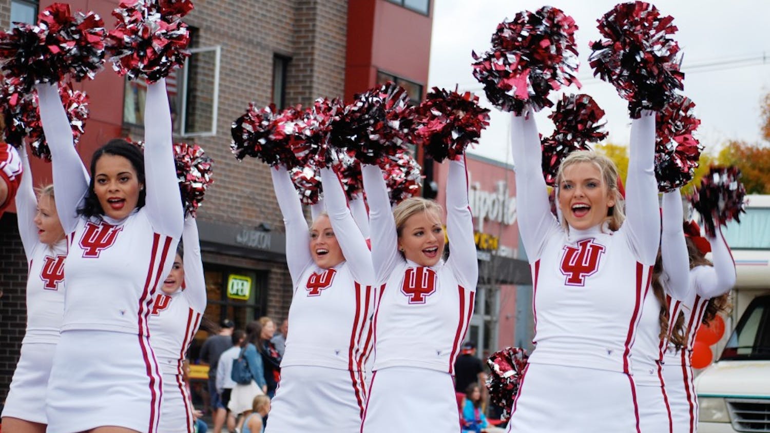 The IU Cheerleaders stop on Kirkwood to get the crowd fired up. The 2014 parade concluded at Sample Gates with a pep rally.