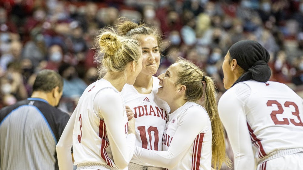 Senior forward Aleksa Gulbe is embraced by teammates after blocking a shot to end the 1st quarter against Michigan State on Feb. 12, 2022, at Simon Skjodt Assembly Hall. Indiana will host the first two rounds of the Women's NCAA Tournament. 