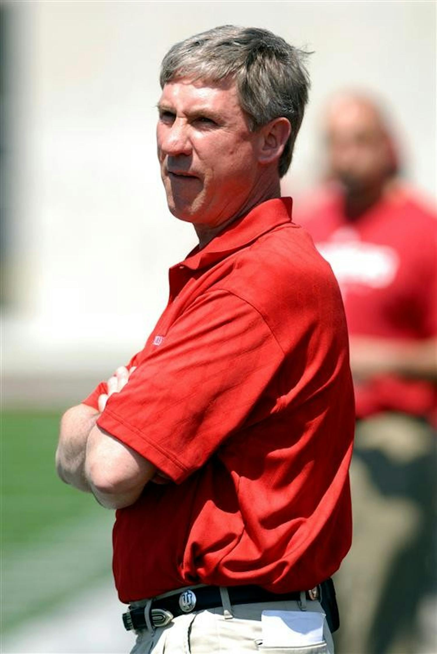 IU football coach Bill Lynch checks the scoreboard during the football team’s spring game on Saturday afternoon at Memorial Stadium. The Crimson beat the Cream, 28-27.