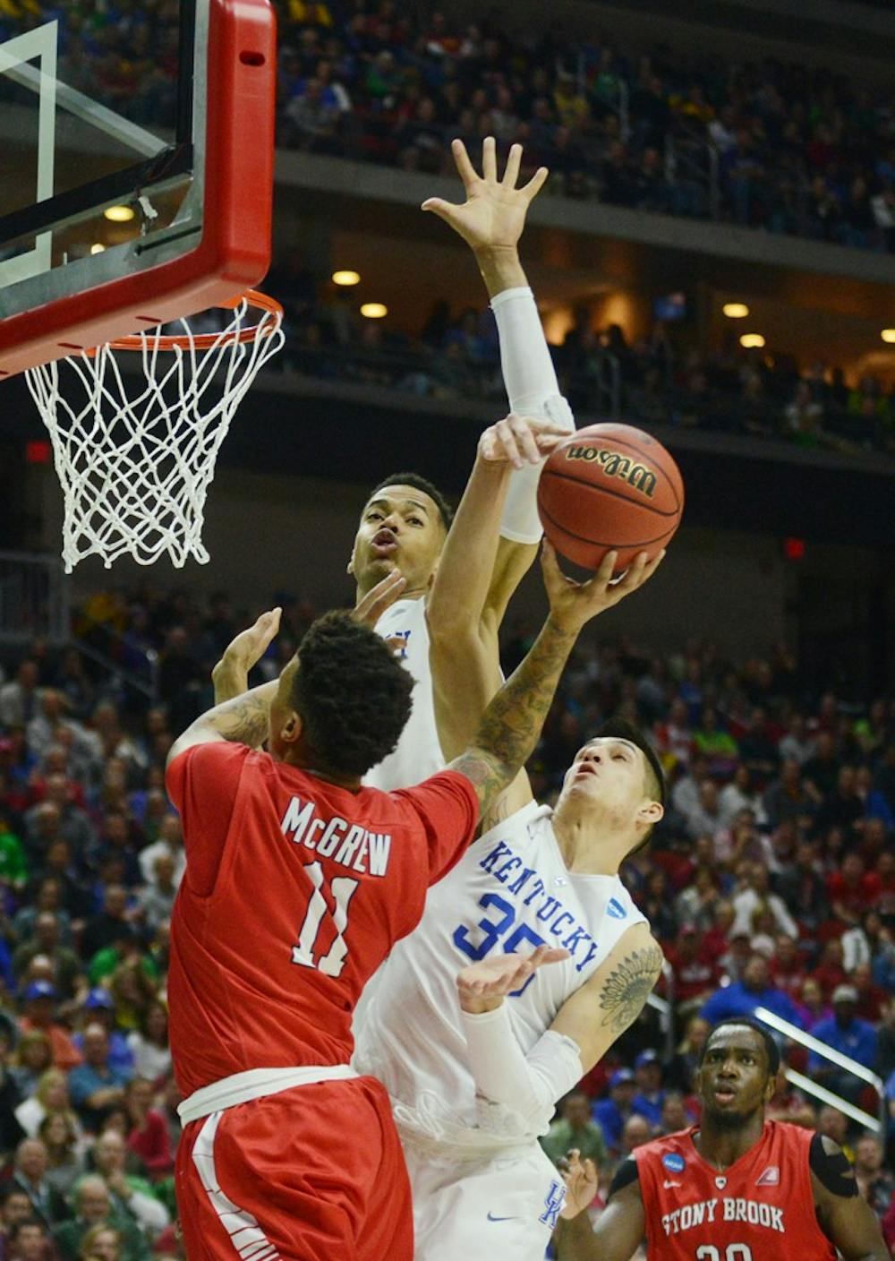 Kentucky forward Derek Willis blocks the shot of Stoney Brook forward Rayshaun McGrew during the NCAA Tournament game Thursday at the Wells Fargo Arena in Des Moines, Iowa. 