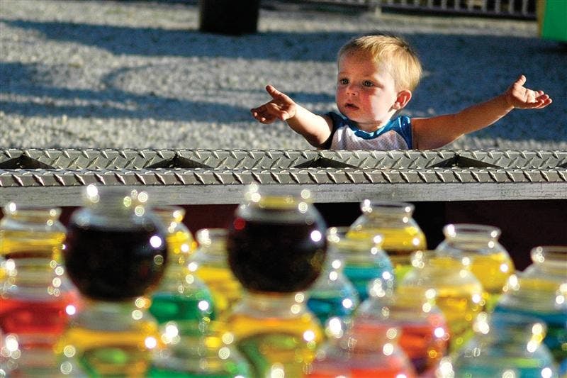 Brayden Honeycutt, 1, plays a game at the 51st annual Fun Frolic on June 14, 2008, in the west parking lot of Memorial Stadium. The event proceeds benefit both IU Campus Child Care and the Big Brothers Big Sisters of South Central Indiana.