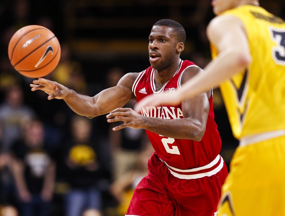 <p>Senior guard Josh Newkirk passes the ball while driving inbound during the Hoosiers' game against the Iowa Hawkeyes on Feb. 17 at Carver-Hawkeye Arena in Iowa City, Iowa. The Hoosiers are the No. 6 seed for the 2018 Big Ten Conference men's basketball tournament.&nbsp;</p>