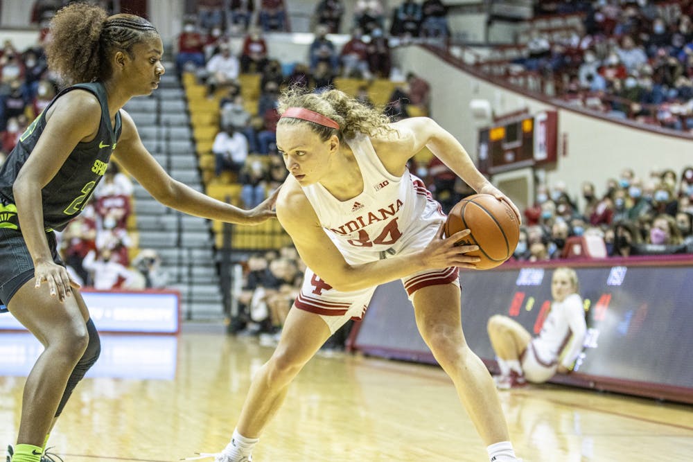 Senior guard Grace Berger holds the ball during the game against Michigan State on Feb. 12, 2022, at Simon Skjodt Assembly Hall. Indiana beat Michigan State 76-58.