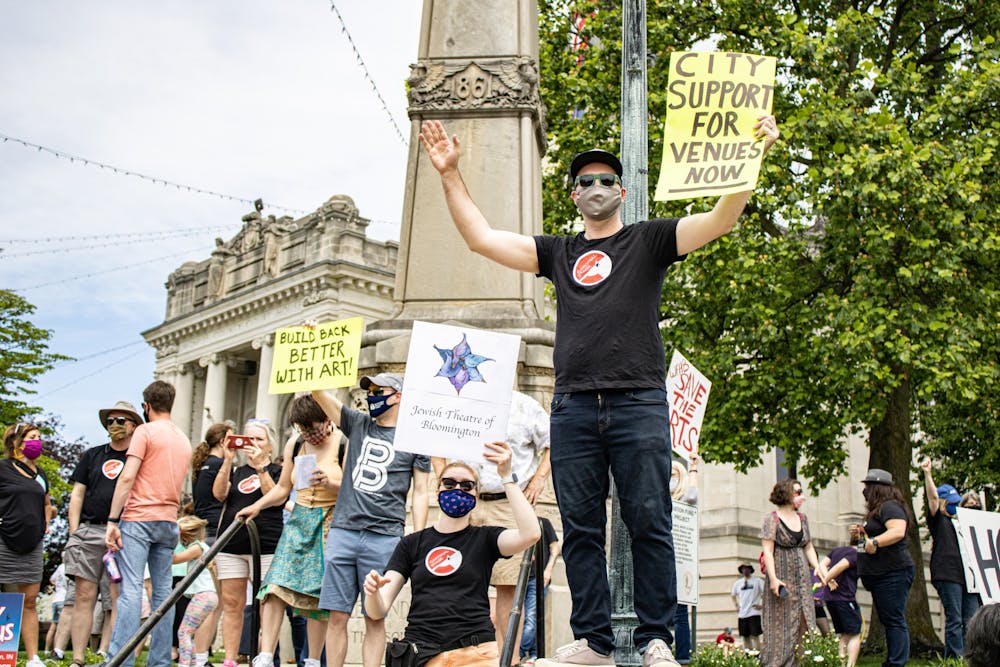 <p>Supporters hold signs at the Save Our Venues Rally on May 22 in front of the Monroe County Courthouse.</p>