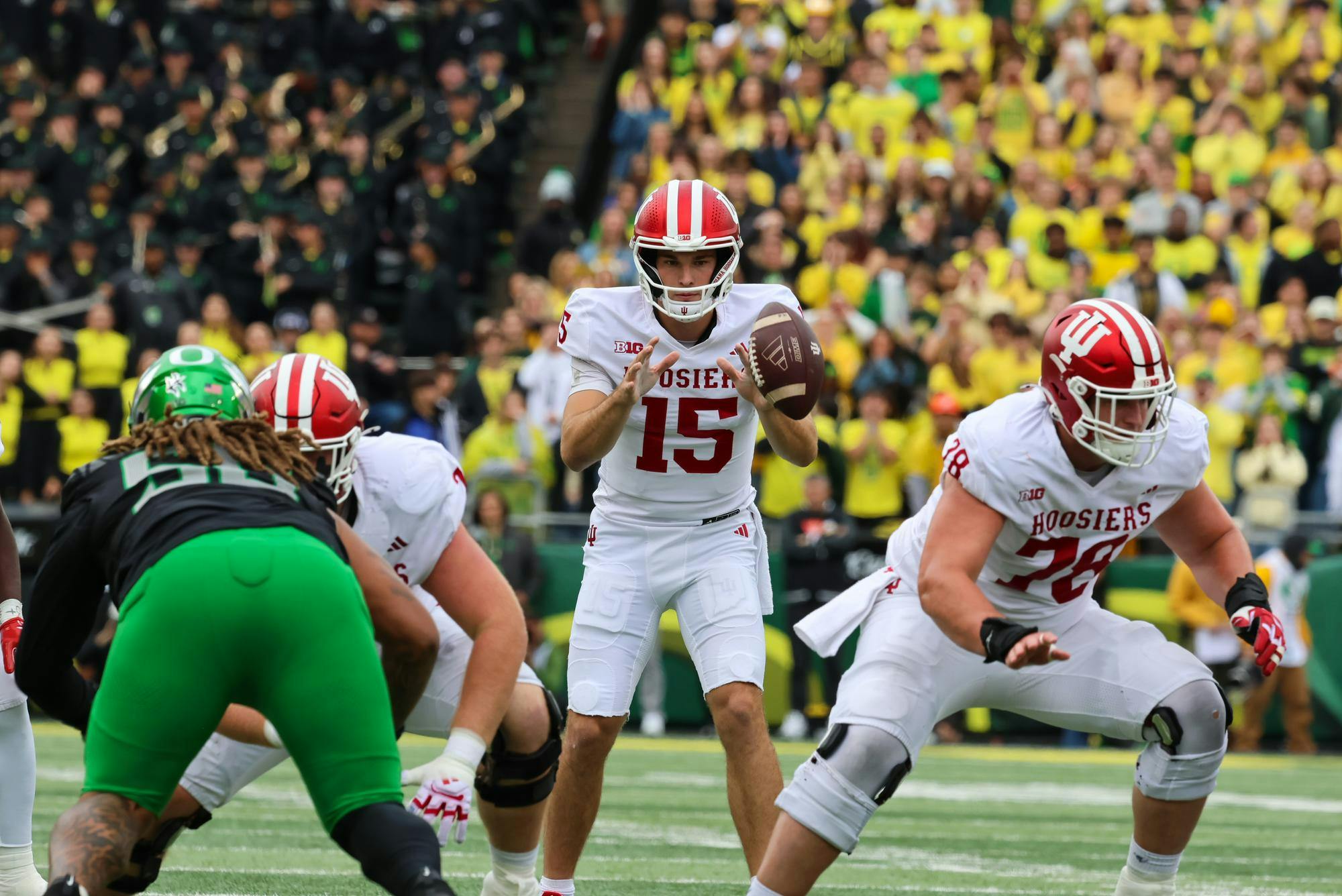 Indiana redshirt junior quarterback Fernando Mendoza catches the snap during the IU versus Oregon game at Autzen Stadium on Oct. 11. Mendoza had 215 passing yards during the game against the Ducks. 