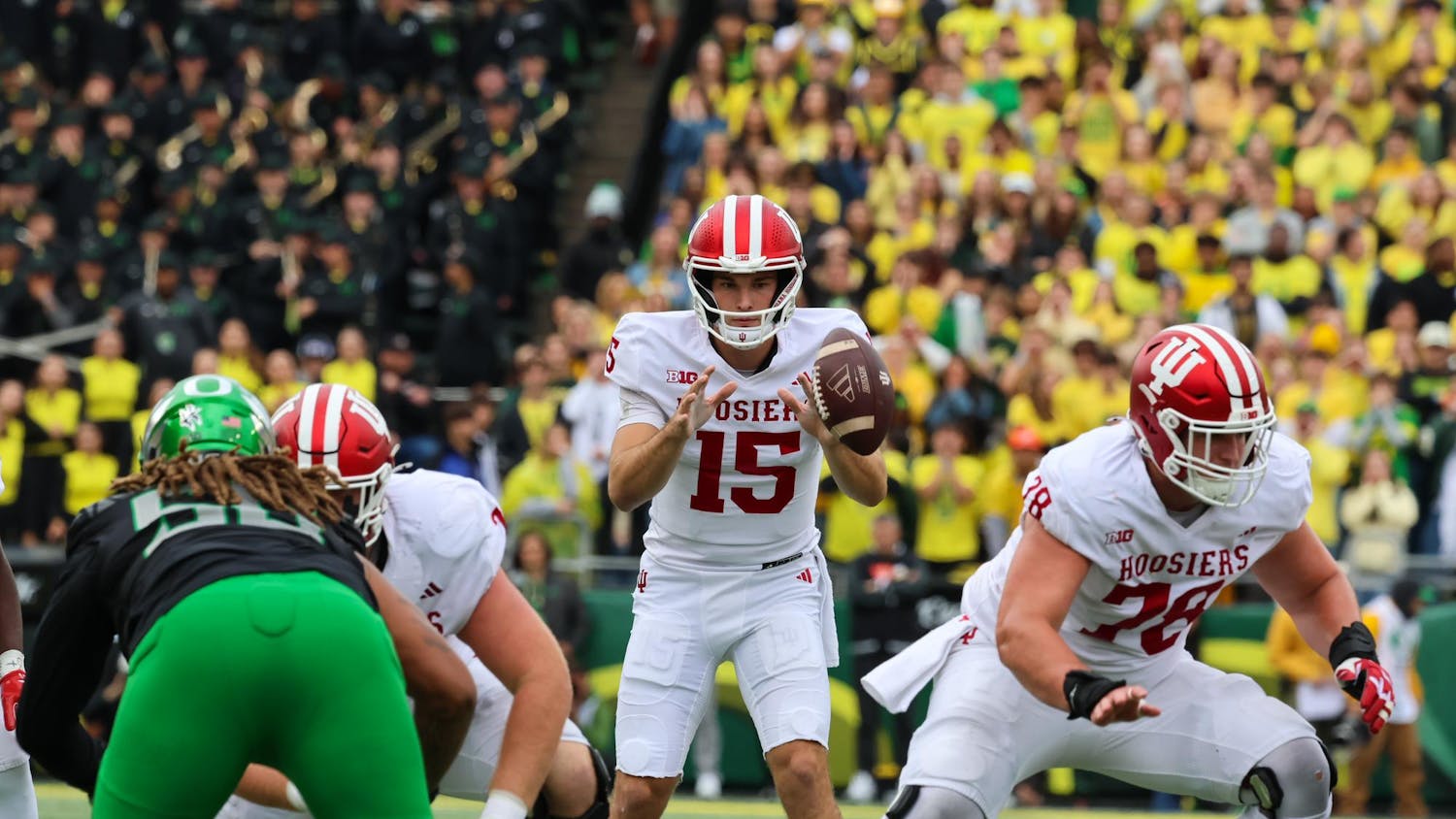 Indiana redshirt junior quarterback Fernando Mendoza catches the snap during the IU versus Oregon game at Autzen Stadium on Oct. 11. Mendoza had 215 passing yards during the game against the Ducks.