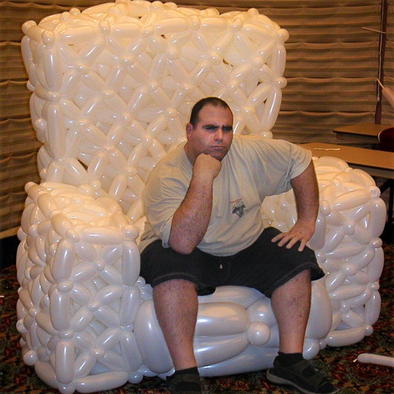 COURTESY PHOTOA man sits in a chair made entirely of balloons at a balloon twisting convention. Every year, hundreds of people from around the globe gather at Twist and Shout, one of the world's premier balloon twisting conventions to compete, attend balloon twisting classes, and make jaw-dropping balloon sculptures. Filmmakers Naomi Greenfield and Sara Taksler explore the art of balloon twisting in their 2007 film Twisted: A Balloonamentary.  