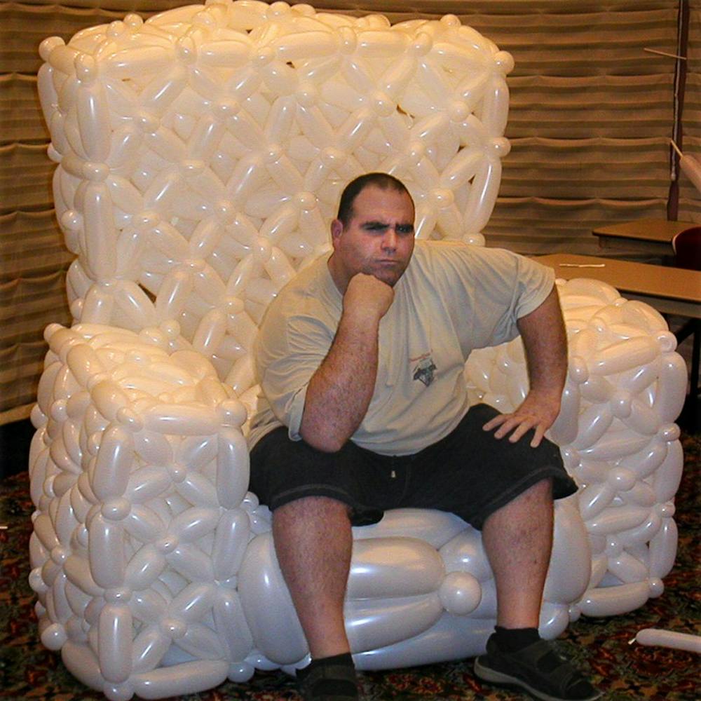 COURTESY PHOTOA man sits in a chair made entirely of balloons at a balloon twisting convention. Every year, hundreds of people from around the globe gather at Twist and Shout, one of the world's premier balloon twisting conventions to compete, attend balloon twisting classes, and make jaw-dropping balloon sculptures. Filmmakers Naomi Greenfield and Sara Taksler explore the art of balloon twisting in their 2007 film Twisted: A Balloonamentary.  