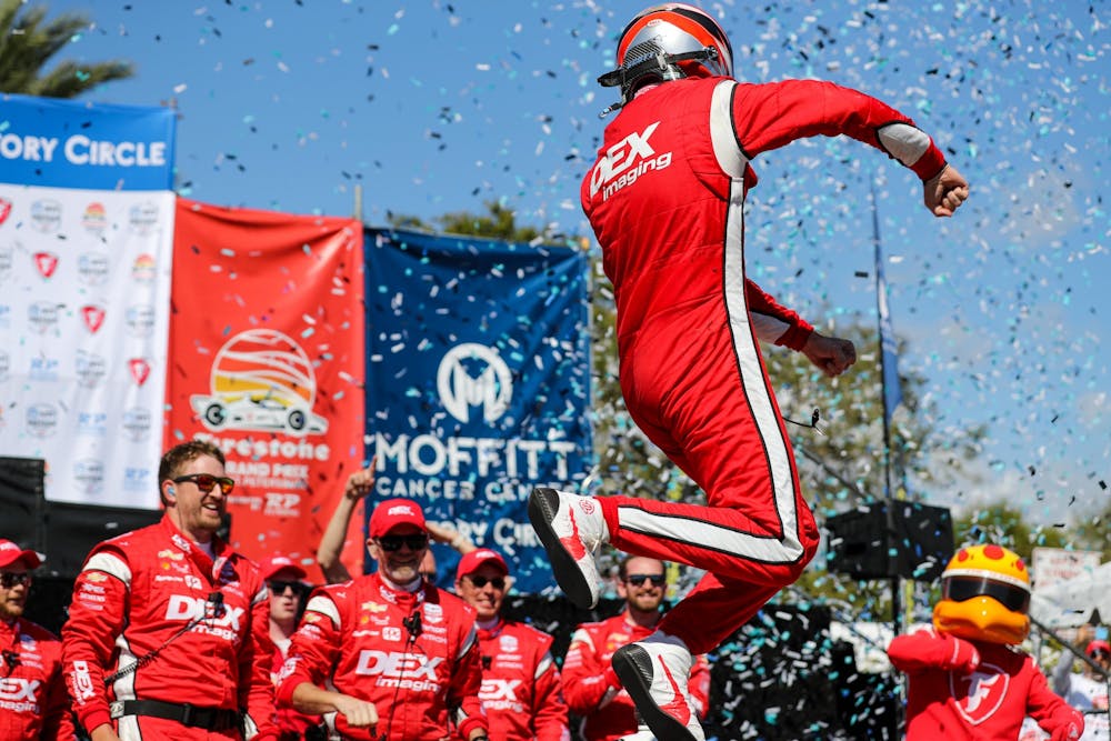 <p>Team Penske IndyCar driver Scott McLaughlin celebrates after winning the Firestone Grand Prix of St. Petersburg on Feb. 27, 2022, in St. Petersburg, Florida. It was McLaughlin&#x27;s first win in the NTT IndyCar Series and required holding off defending series champion Alex Palou.</p>