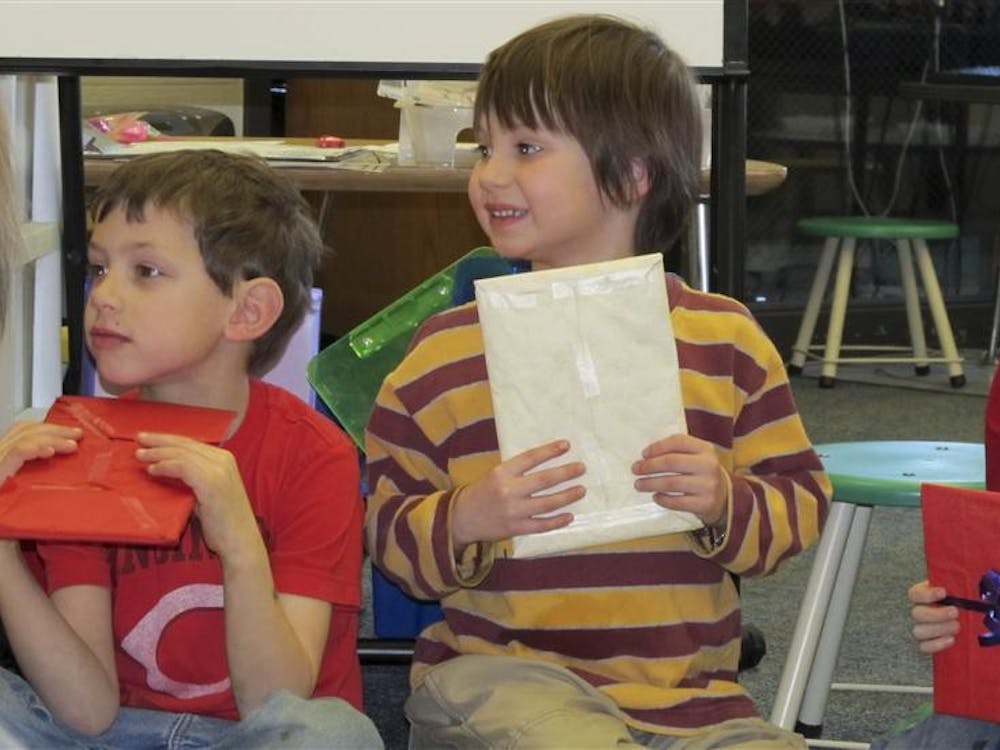 Students in Sarah Murray's kindergarten class at Childs Elementary School prepare to exchange books on Thurdsay in celebration of International Book Giving Day. Students brought in a book each to share with their classmates. 