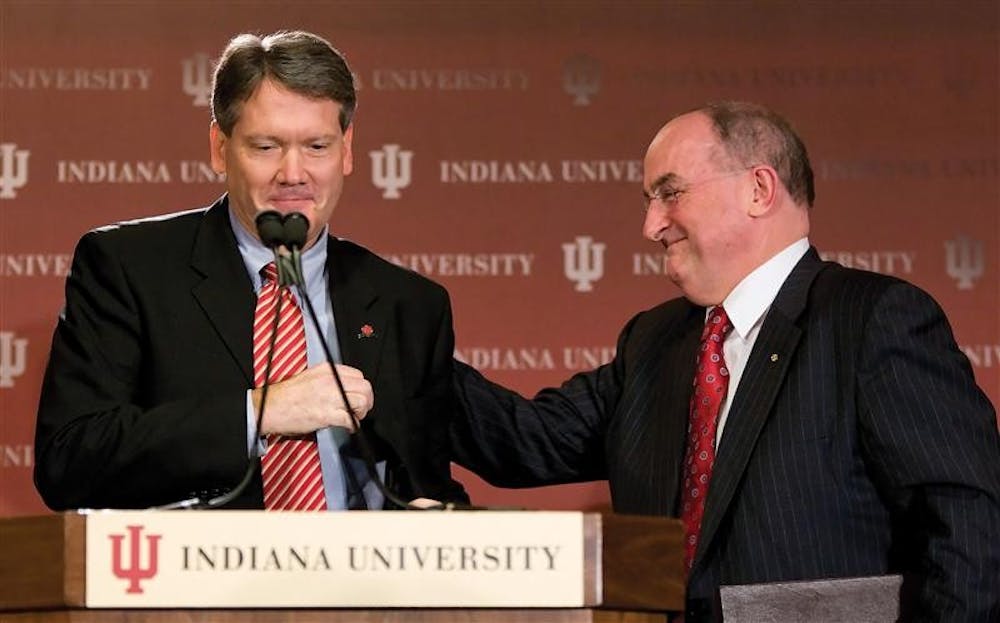 Indianapolis attorney Fred Glass, left, is introduced by IU President Michael McRobbie at a press conference announcing Glass as the new IU athletics director Tuesday at the DeVault Alumni Center. Glass, a partner at Baker & Daniels in Indianapolis, is an IU alumnus.