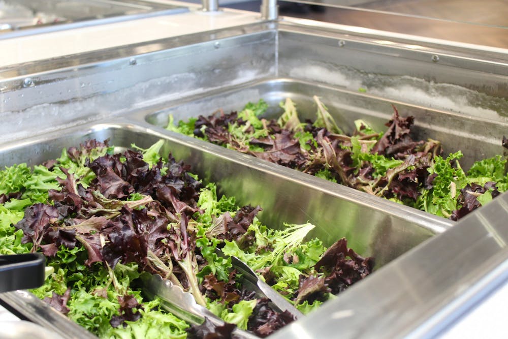 <p>Serving trays of a spring mix salad are seen Dec. 13, 2022, in Goodbody Eatery. Fruits and vegetables, like kale and apples, are high in flavonols, a compound that has been proven to slow the effects of memory loss.</p>
