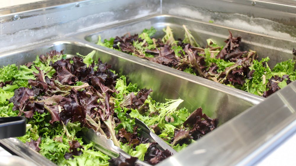Serving trays of a spring mix salad are seen Dec. 13, 2022, in Goodbody Eatery. Fruits and vegetables, like kale and apples, are high in flavonols, a compound that has been proven to slow the effects of memory loss.