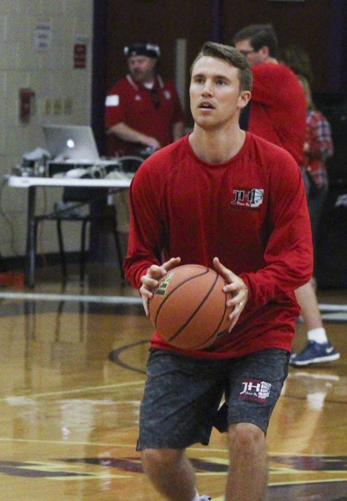Jordan Hulls plays basketball with students during his basketball camp Wednesday afternoon at Bloomington South High School. “I grew up in Bloomington, and Bloomington South was my high school. I want to give back to this community,” Hulls said.