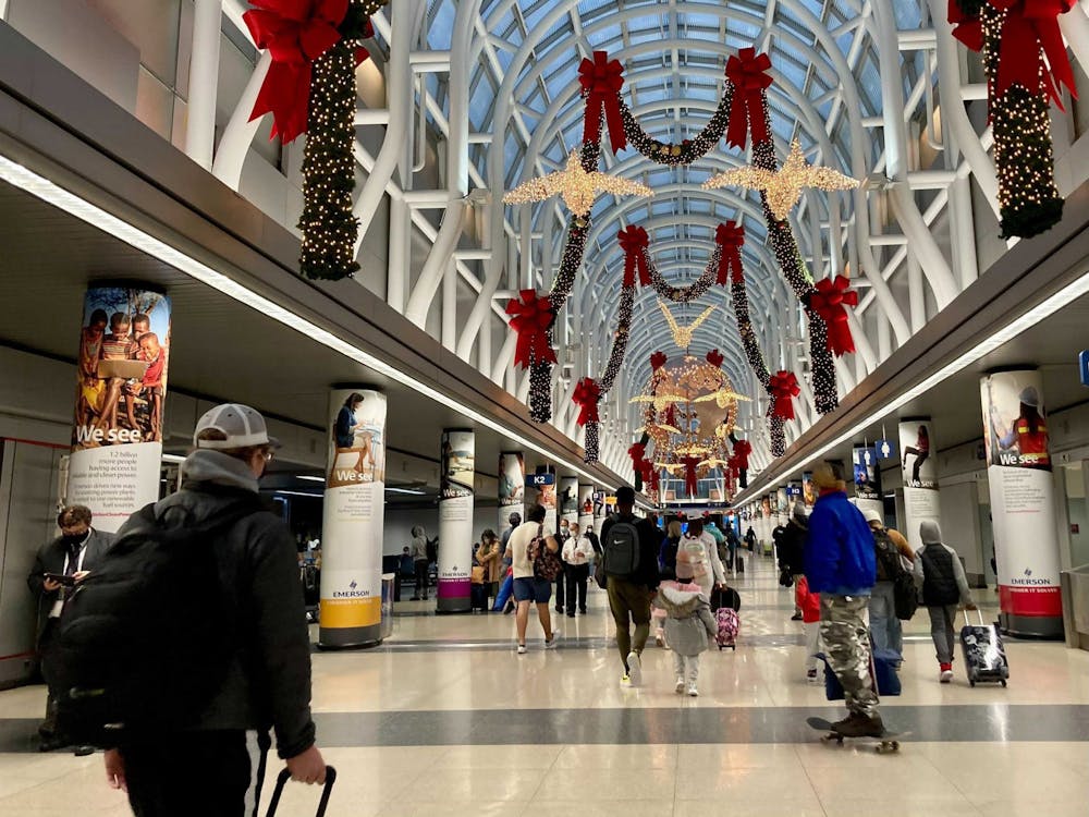 Thanksgiving travelers walk through Terminal 3 on Nov. 25 at O'Hare International Airport in Chicago.