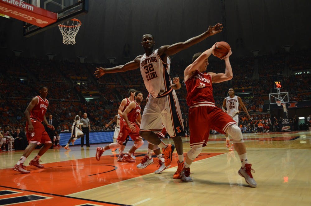 Junior guard Nick Zeisloft pulls in a rebound behind Illinois center Nnanna Egwu. Zeisloft finished with 10 points in the Hoosiers' win. 