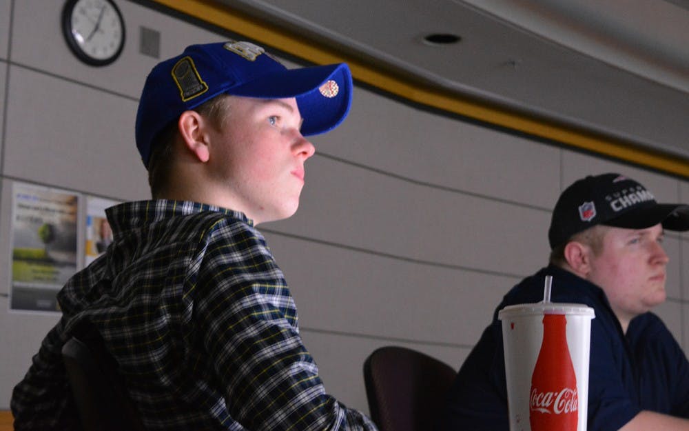 Freshman Brendan Blankfield, left, and freshman Charles Frank, watch highlights from the Feb. 7 healthcare debate. They joined the College Republicans at IU for a discussion about the future of healthcare in the United States.