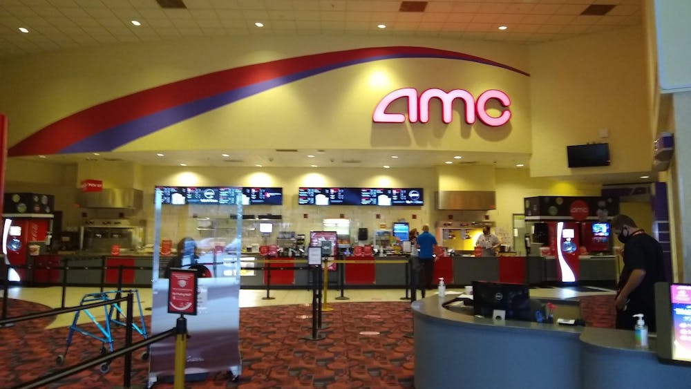 Patrons walk through the concessions area of the AMC Classic Bloomington 12. Movie theaters across the country have reopened in recent weeks after making changes to deal with the coronavirus pandemic.
