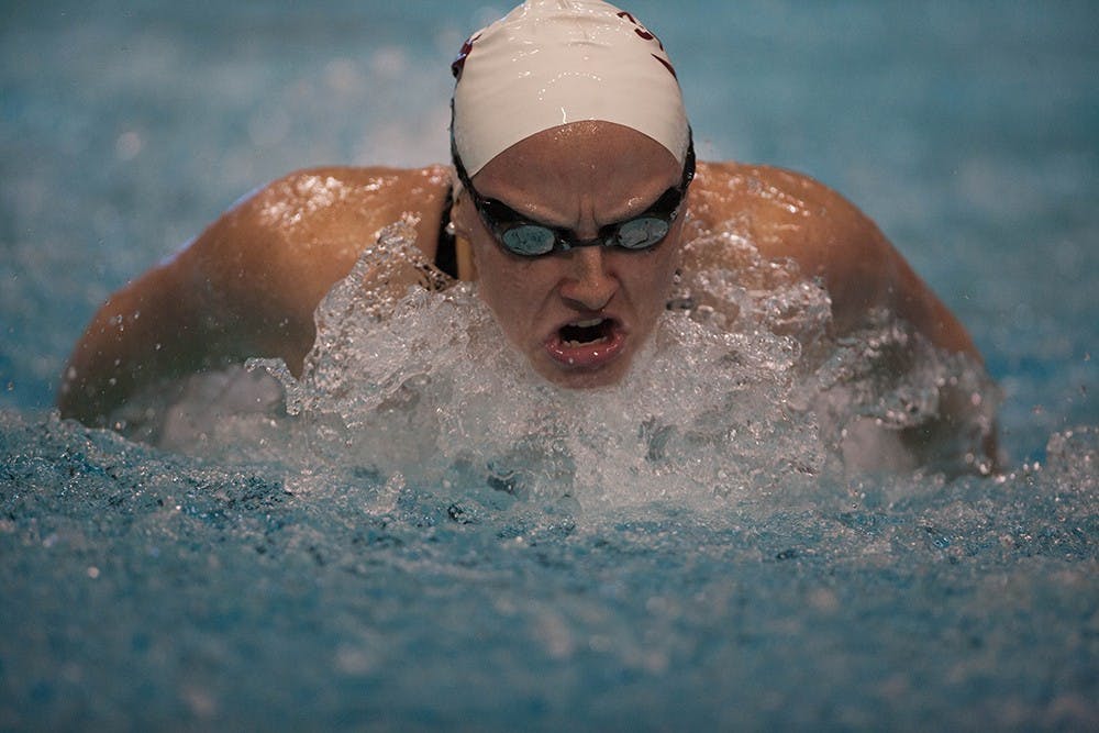 Junior Bailey Pressey swims the butterfly leg of the 400 yard IM on Friday night at the Hoosierland Invitational.
