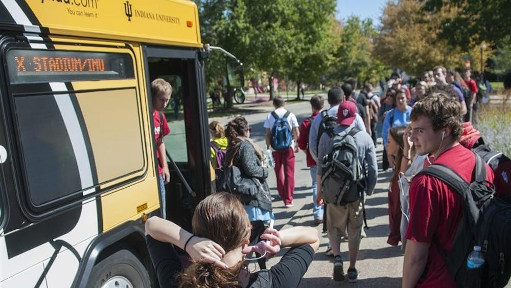 Students wait to board the X bus Tuesday outside of the Indiana Memorial Union. 