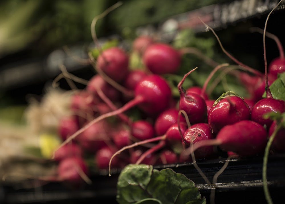 Radishes sit in the fresh vegetable section of Bloomingfoods Sunday. The IU Food Project focuses on educating undergraduates on nutrition, and it raises awareness regarding food-related social, environmental, economic and cultural issues.&nbsp;