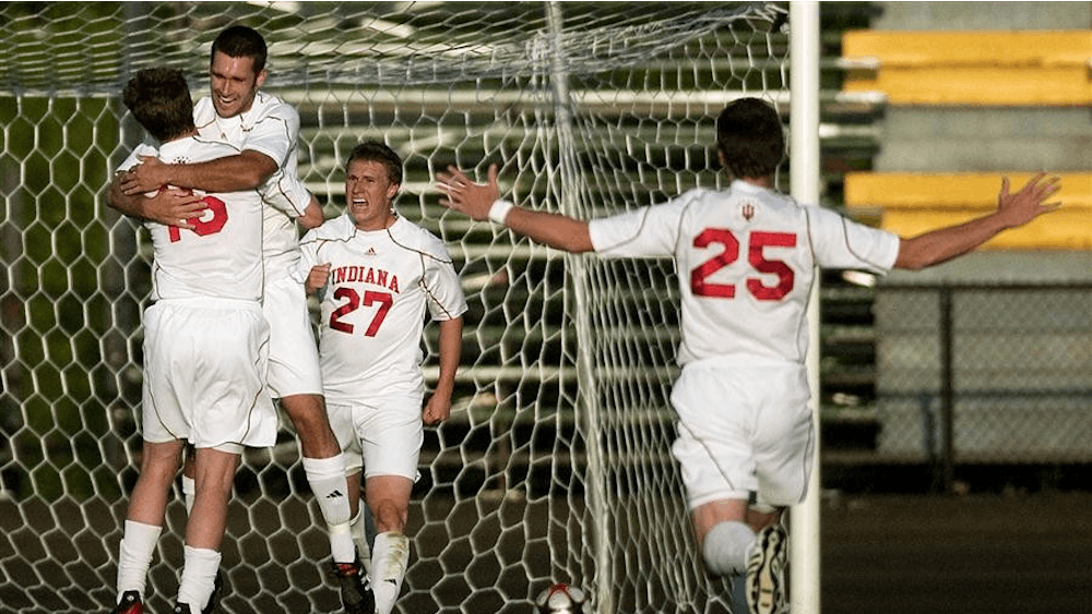 Teammates congratulate sophomore midfielder Tyler McCarroll (left) after the opening goal in IU's contest against the U-20 Mexican Youth National Team Tuesday at Bill Armstrong Stadium.