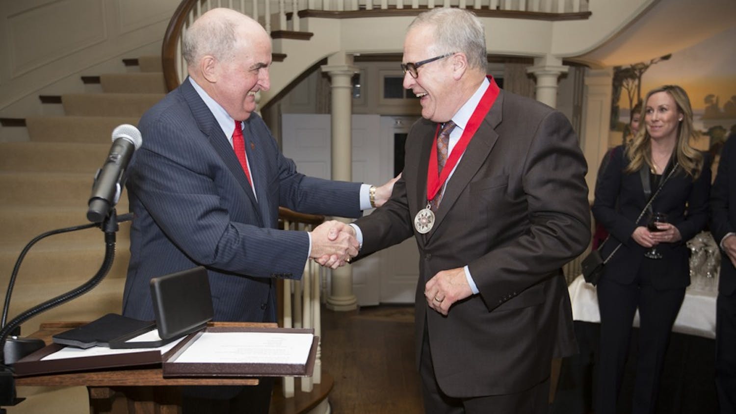 IU President Michael McRobbie awards the President's Medal for Excellence to John Lechleiter. The award is the highest honor an IU president can award and is given to recognize exceptional distinction in public service.