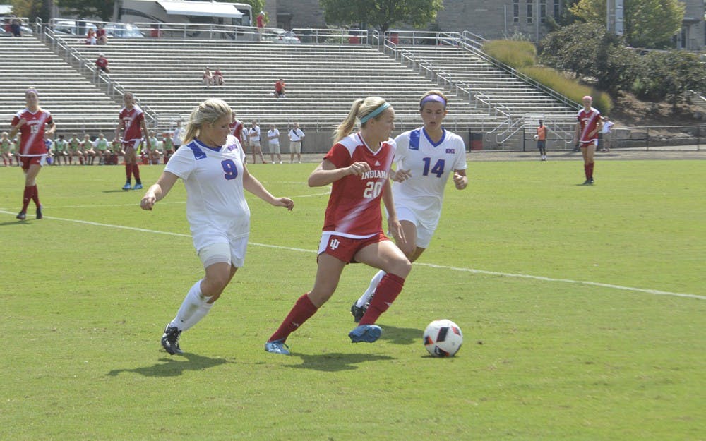 Caroline Dreher defends the ball against Southern Methodist University players during a match on Monday, September 5 at Bill Armstrong Stadium. 