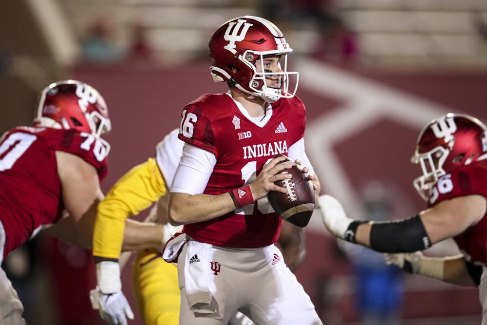 <p>Sophomore quarterback Grant Gremel drops to throw against Minnesota on Nov. 20, 2021, at Memorial Stadium in Bloomington. Gremel earned a roster spot as a walk-on in 2019.</p>