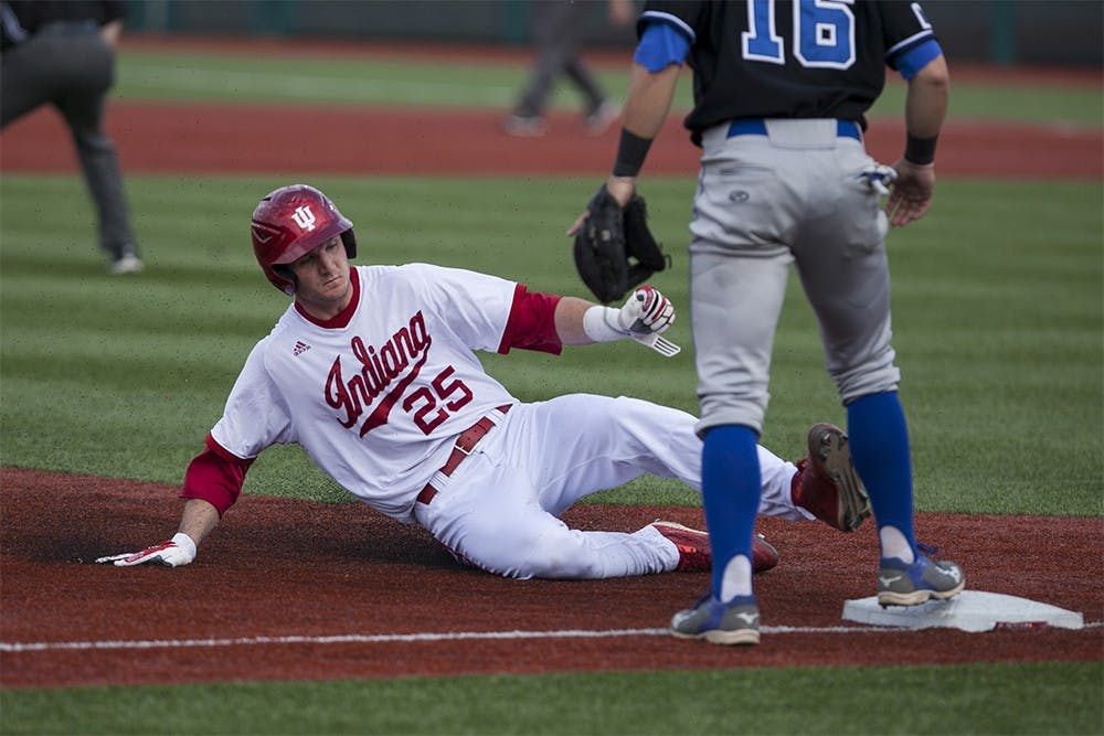 Senior designated hitter Brad Hartong slides into third base on Wednesday at Bart Kaufman Field.