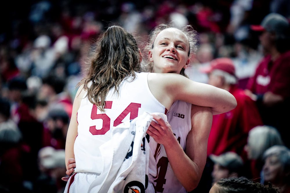 <p>Senior Mackenzie Holmes and senior Grace Berger hug during the final seconds Feb. 19, 2023, at Simon Skjodt Assembly Hall in Bloomington. Indiana beat Purdue 83-60.</p>