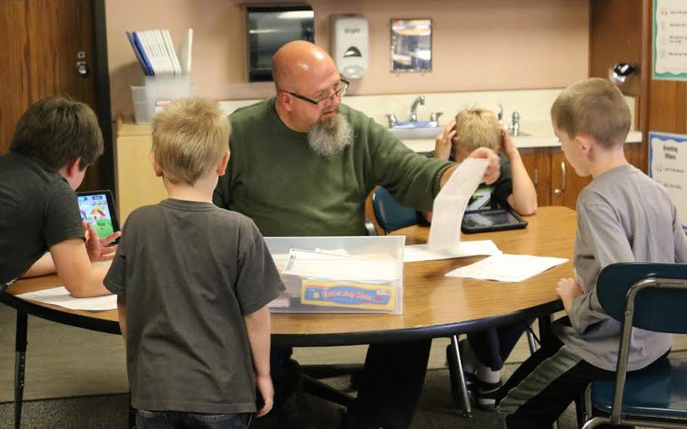 Special education teacher at Highland Park Elementary School Kraig Bushey works with students in the classroom on focusing skills to prepare them for traditional classrooms in the future. 