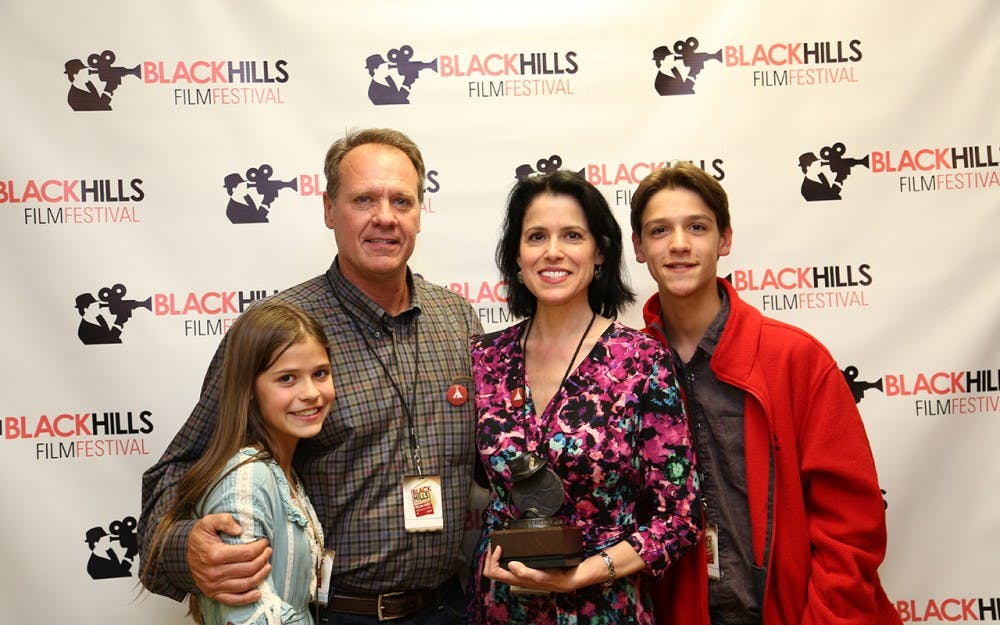 Molli Cameron, IU graduate and filmmaker behind the Indie feature film "Lakota Girls," which won the People's Choice Award at the Black Hills Film Festival in South Dakota. She is pictured with husband and co-producer Russell, and children Clara and Cavan. Clara was a co-lead in the film.&nbsp;