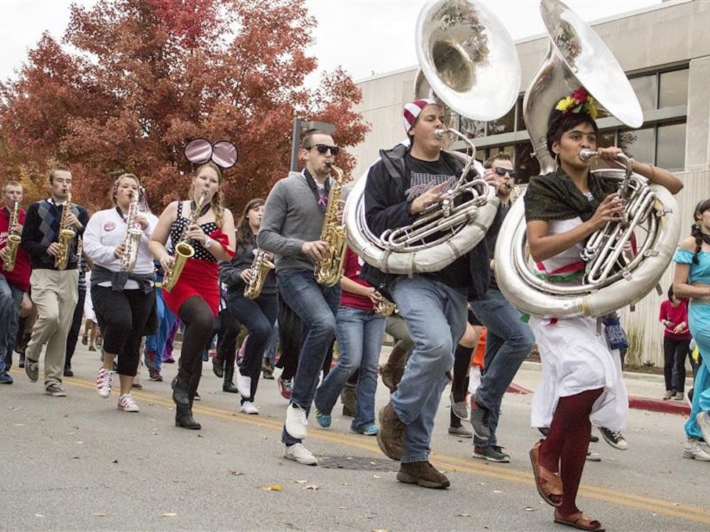 Members of the Marching Hundred perform at the homecoming parade on Kirkwood Ave. 
