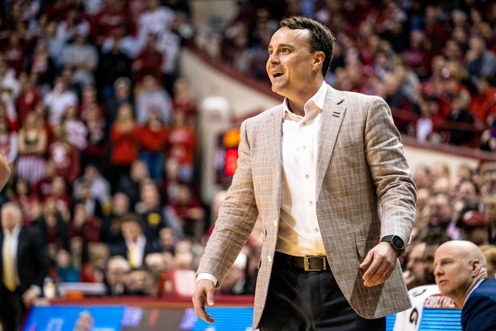 <p>Head coach Archie Miller smiles Feb. 13 after IU gains a lead against Iowa in the first half of the game in Simon Skjodt Assembly Hall.</p>