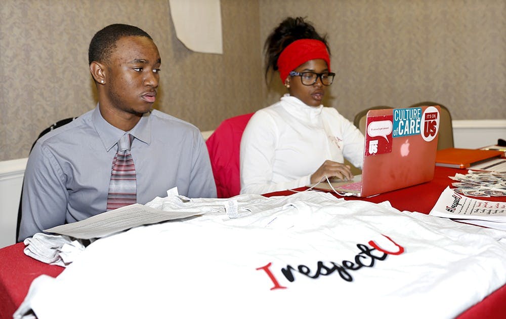 Kendrick Washington, left, and Diamond Turner advertise "IrespectU" campaign during the involvment fair Monday at Gerogian Room in the IMU. The IrespectU campaign promotes multiculture and diverse social identities at IU. 