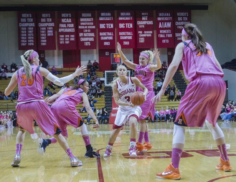 Freshman guard Tyra Buss drives through the Illinois defense before scoring a layup on Wednesday at Assembly Hall. The Hoosiers won 85-58.