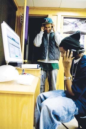 BFA President Joby Wright (background) and BFA artist Randell Hopkins, a.k.a. Lil’ 1, pictured at the BFA studios. BFA is not only dedicated to quality recording, it also helps artists who are seeking promotion, booking or marketing.  The BFA producers can edit the recorded music  or teach the artists how to do it themselves.