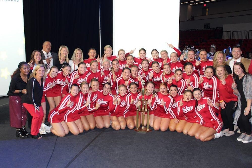 <p>The IU Crimson all-girl cheerleading team surrounds its trophy after winning the national championship Jan. 20. The Hoosiers placed first in the All Girl Division IA at the UCA &amp; UDA College Cheerleading and Dance Team National Championship.</p>
