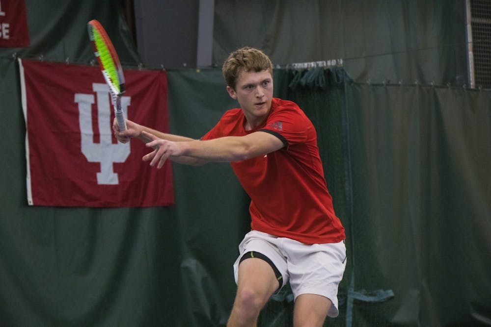 <p>Then-junior Carson Haskins watches the ball during a match against the University of Notre Dame Feb. 1, 2020, at the IU Tennis Center. Indiana men&#x27;s tennis won three of the five brackets at the Louisville Invite last weekend.</p>